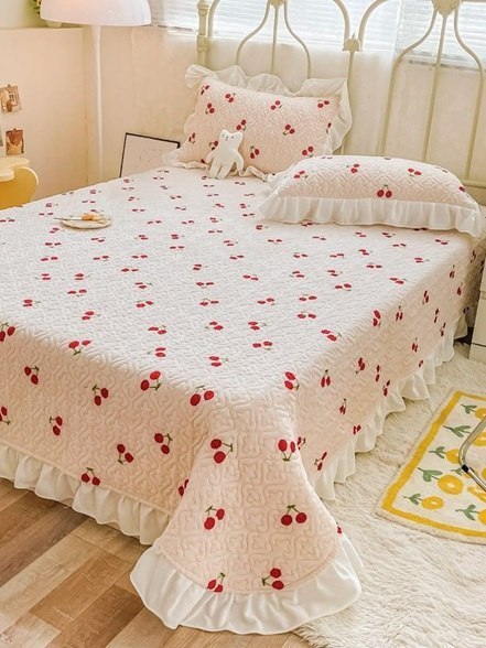 cherry bedspread paired with vintage furniture