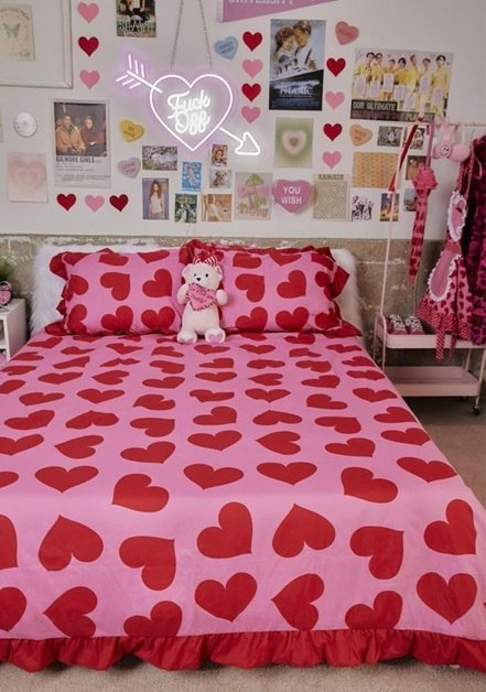 A vibrant red heart-patterned bedspread