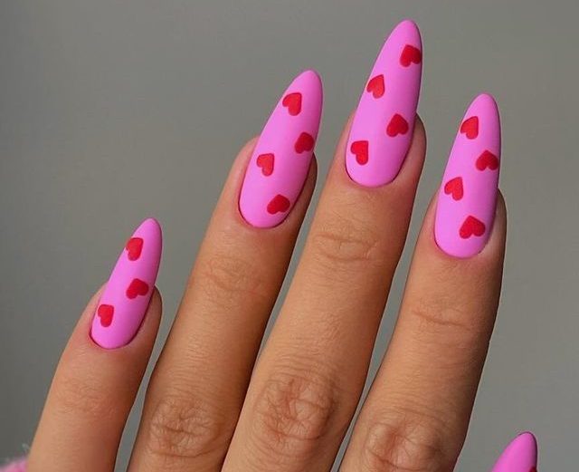 Matte Pink Nails with Bold Red Hearts